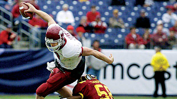Arkansas quarterback Matt Jones tries to get around Minnesota linebacker Terrance Campbell in the first half of a 29-14 loss in the Music City Bowl in Nashville Dec. 30, 2002.